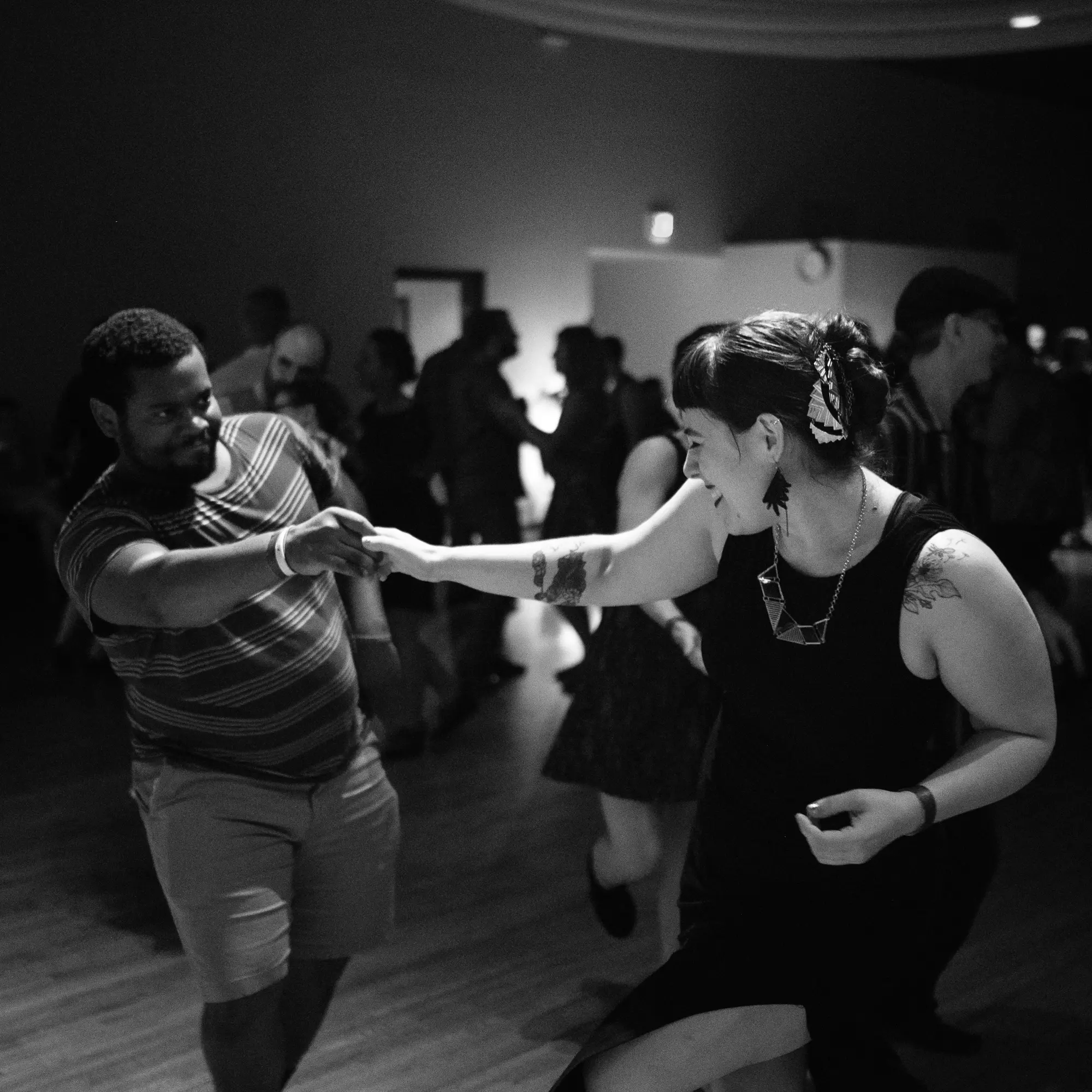 black and white photo of couple partner dancing in open position
