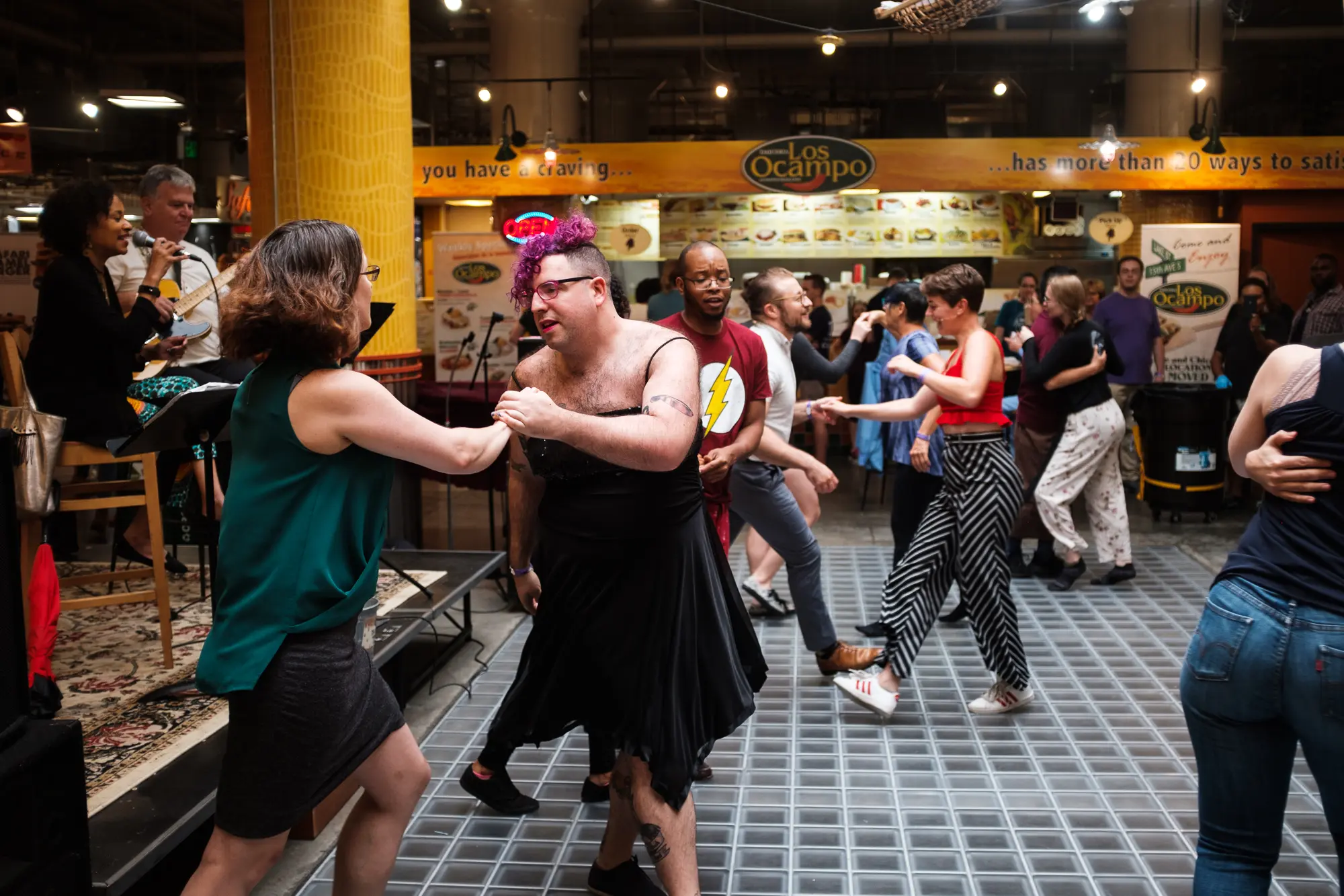 photo of people social dancing to live music at Midtown Global Market