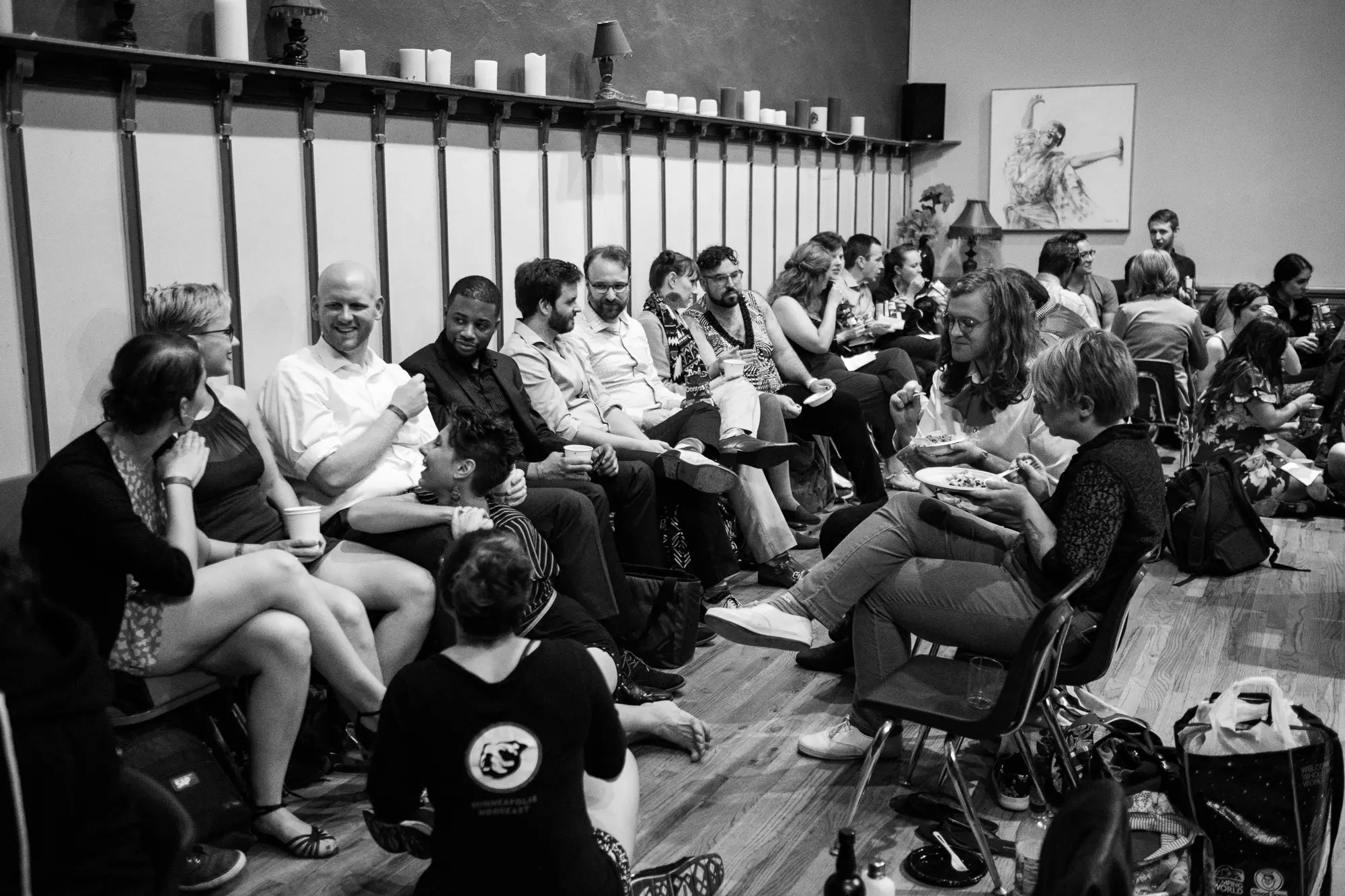 black and white photo of people eating and socializing at Four Seasons Dance Studio