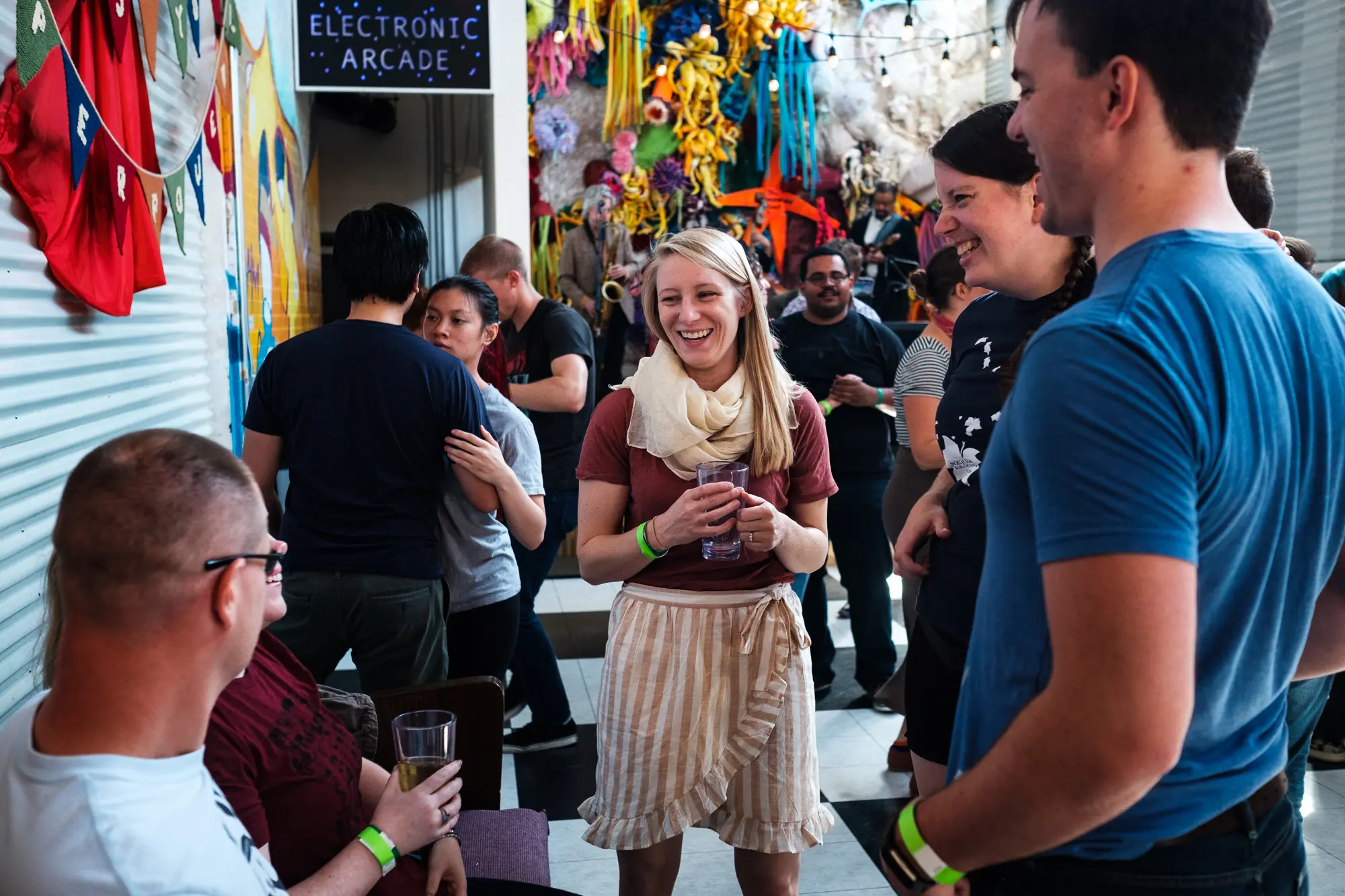 colorful photo of people socializing at a dance