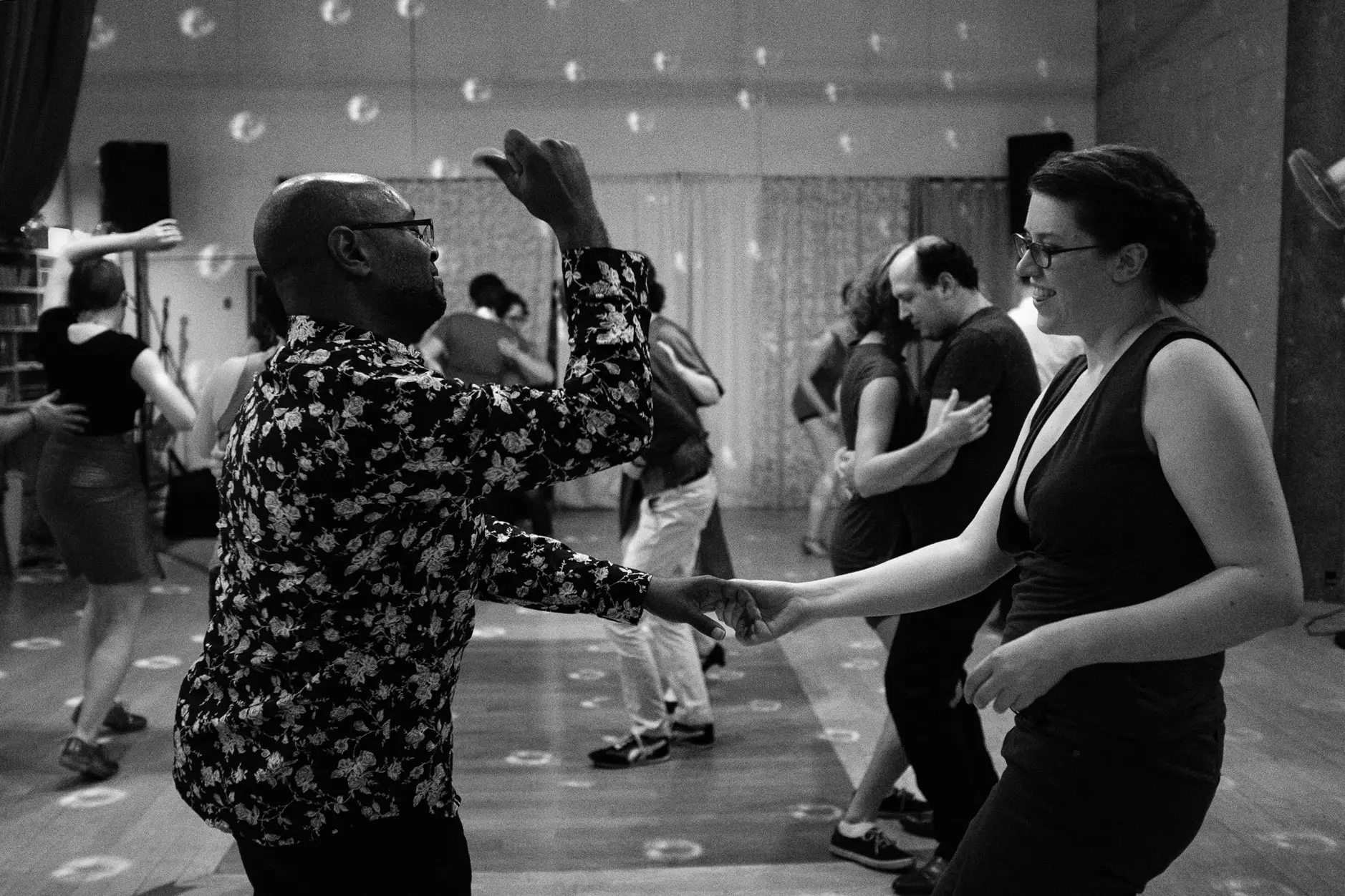 black and white photo of people dancing